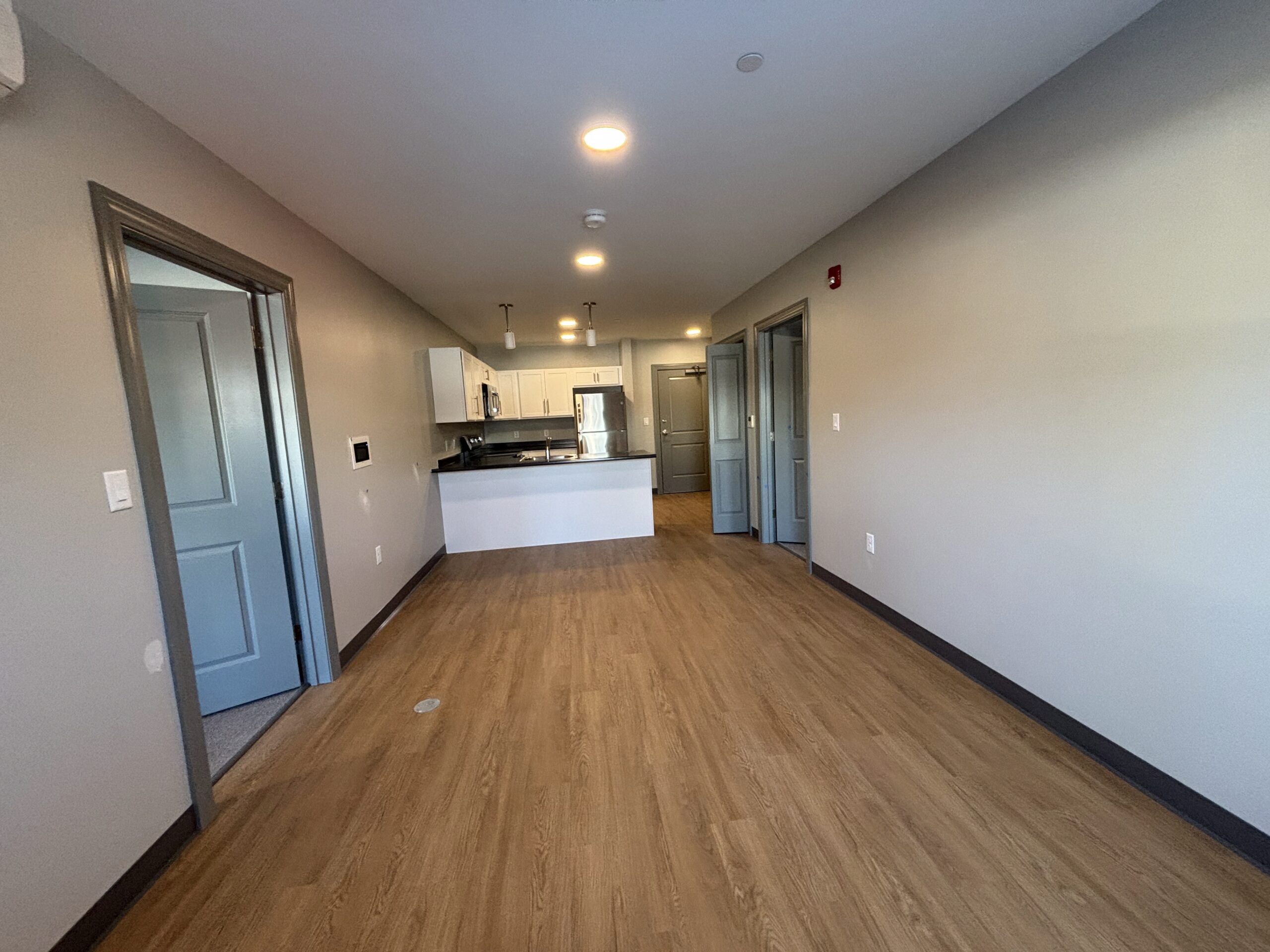 View from the far corner of the living space of a 2 bedroom affordable living apartment.