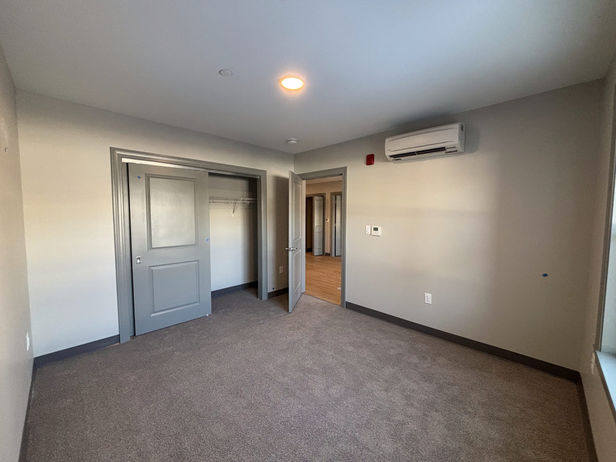 View from the far corner of the bedroom of a 2 bedroom affordable living apartment.